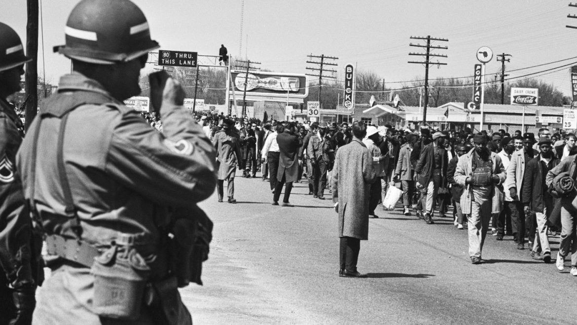 When President Lyndon B. Johnson federalized the National Guard, it meant that the President took control of National Guard units from their respective states, placing them under federal authority. This action allowed the federal government to deploy these troops for national purposes, such as enforcing federal laws or responding to crises beyond state lines.

A significant example of this occurred during the Civil Rights Movement and the Watts Riots in the 1960s. Johnson federalized the California National Guard in 1965 to help restore order during the Watts Riots, giving the federal government direct control to manage the situation more effectively. This move bypassed potential delays or conflicts with state leadership.

In general, federalizing the National Guard grants the President the power to quickly mobilize troops nationwide, ensuring a unified response to emergencies, but it can also create tension between state and federal governments over control of military forces.